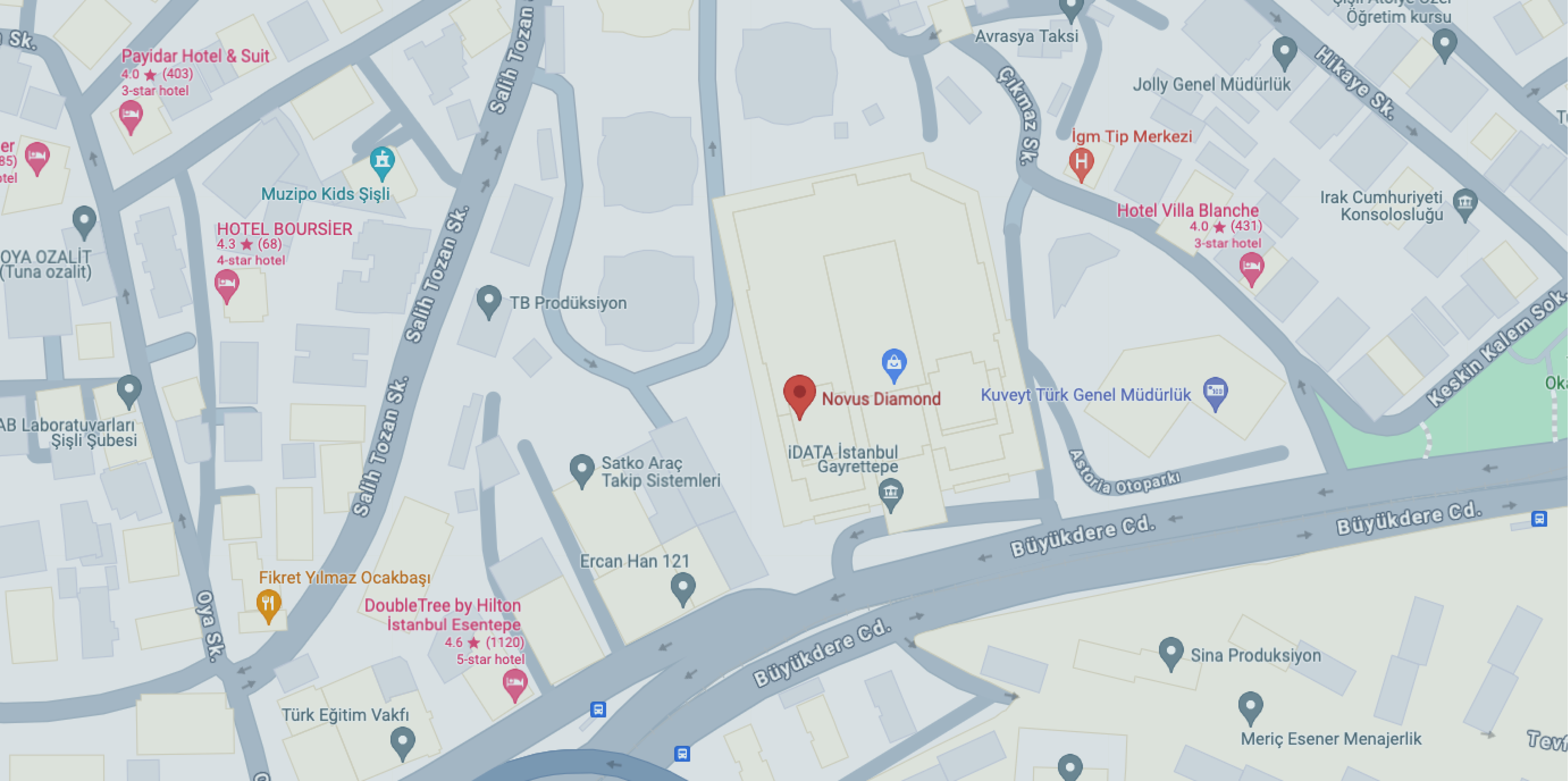 A digital map showing the location of Novus Diamond in Istanbul, Turkey. Nearby landmarks include iDATA Istanbul Gayrettepe, Hotel Boursier, DoubleTree by Hilton Istanbul Esentepe, and Hotel Villa Blanche. The map highlights major roads such as Büyükdere Cd. and Salih Tozan Sk., along with nearby businesses and transportation routes.